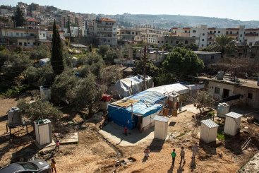 As refugees from Syria push to find spaces for refuge in Lebanon, informal tent settlements have sprung up across the country. This settlement in Akkar, North Lebanon, is home to eight families. Source: DANISH REFUGEE COUNCIL/ JALIL (2015).